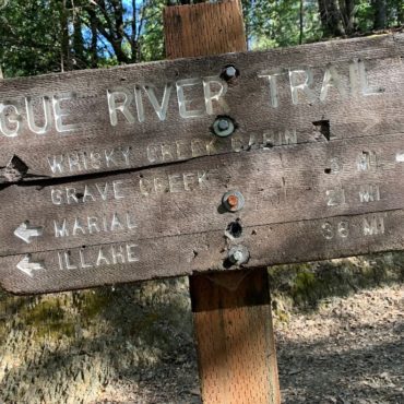 Wooden sign that says Rogue River Trail